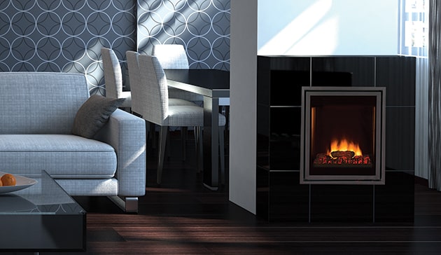 Small electric fireplace in a room with grey decor.