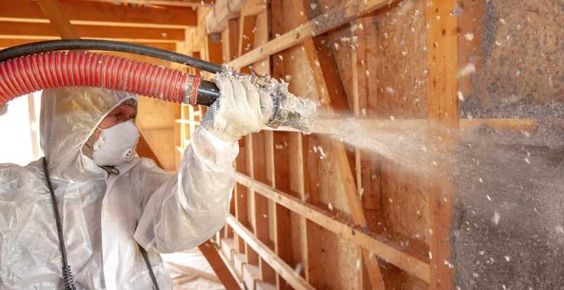 cellulose insulation installer, insulating home's walls.