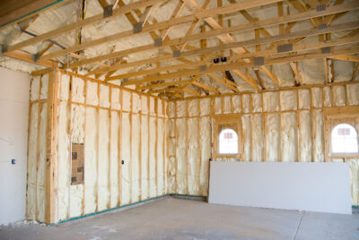 A room at a newly constructed home is sprayed with insulating foam before the drywall is added.