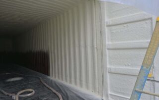 Interior of storage container with closed cell spray foam insulation applied to walls and ceiling by G&S Insulating in Little Rock, AR.