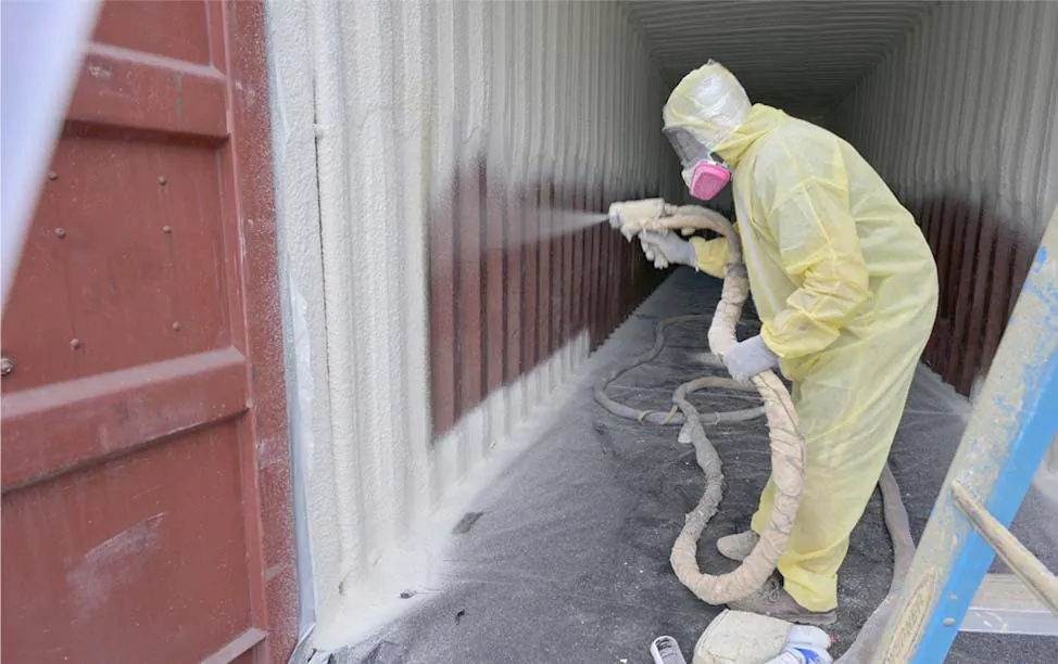 G&S Insulating technician applying closed cell spray foam insulation inside a storage container in Little Rock, AR.