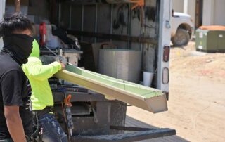 G&S Insulating crew removing a seamless gutter section. G&S Insulating crew removing a seamless gutter section from a mobile fabrication truck in Little Rock, AR.