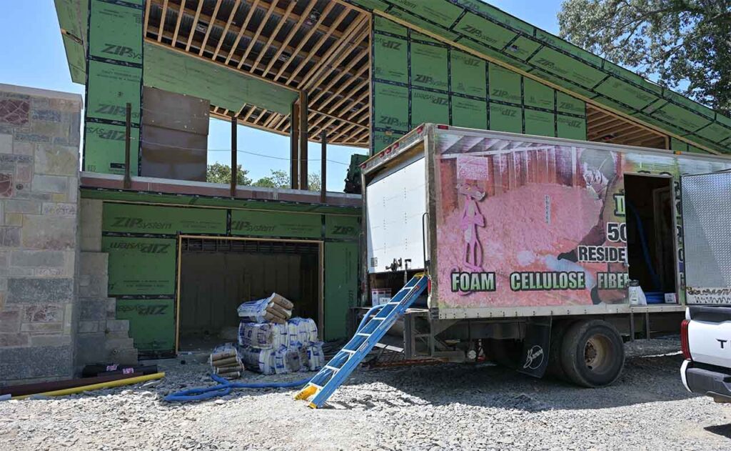G&S Insulating supply truck and insulation materials at job site in Little Rock, AR.