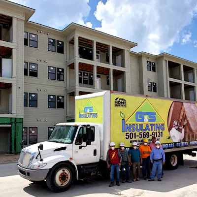 G&S Insulating team and branded service truck at a multifamily construction site in Little Rock, AR.
