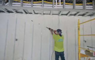 G&S Insulating technician spraying foam insulation, pool house addition, Little Rock, AR.