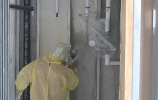 Spray foam insulation around plumbing chase in pool house addition, Little Rock, AR.