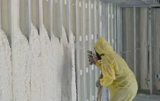 Spray foam insulation on wall below roof trusses, pool house addition, Little Rock, AR.