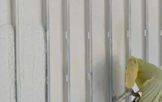 Spray foam insulation wall bay next to cured foam, pool house addition, Little Rock, AR.
